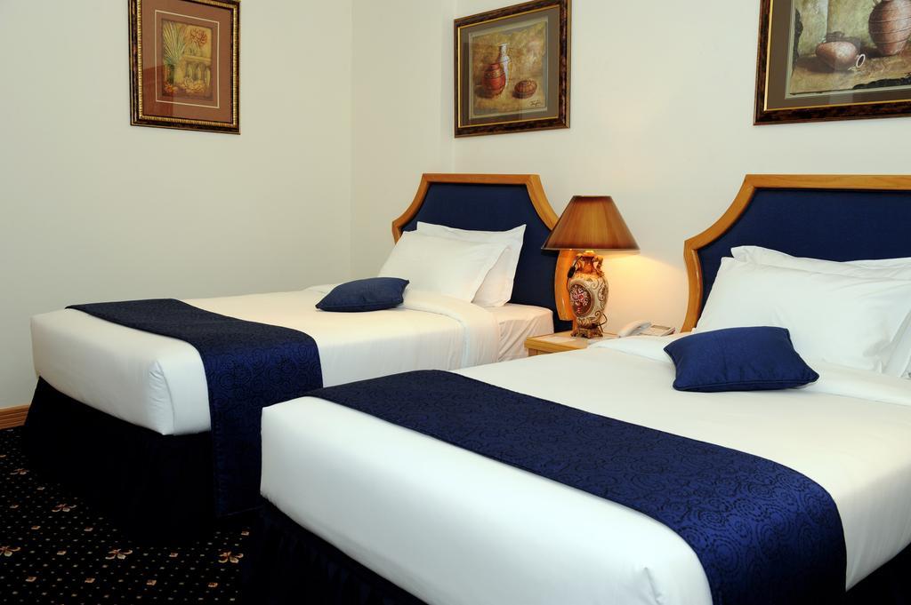 Cayam Hotel Doha Quarto foto